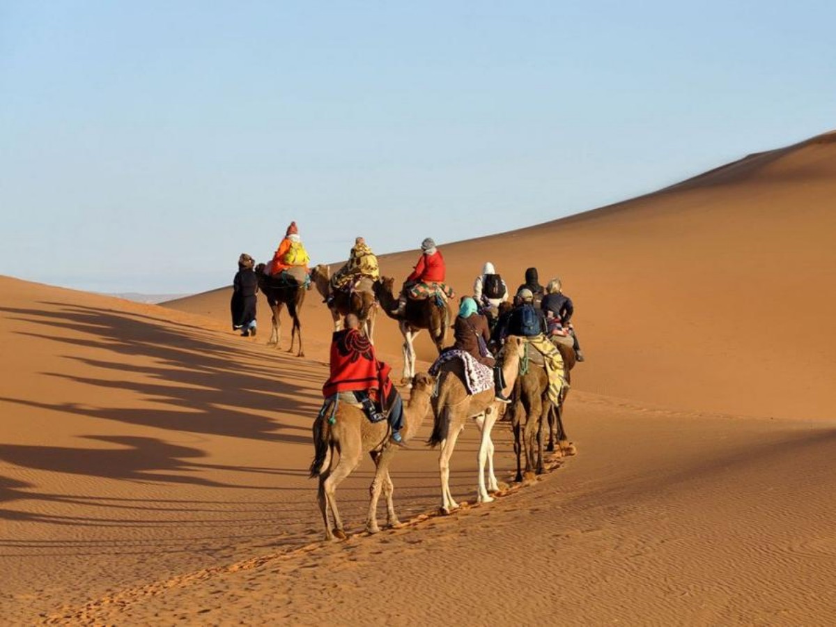 1. Riding a camel across the dunes