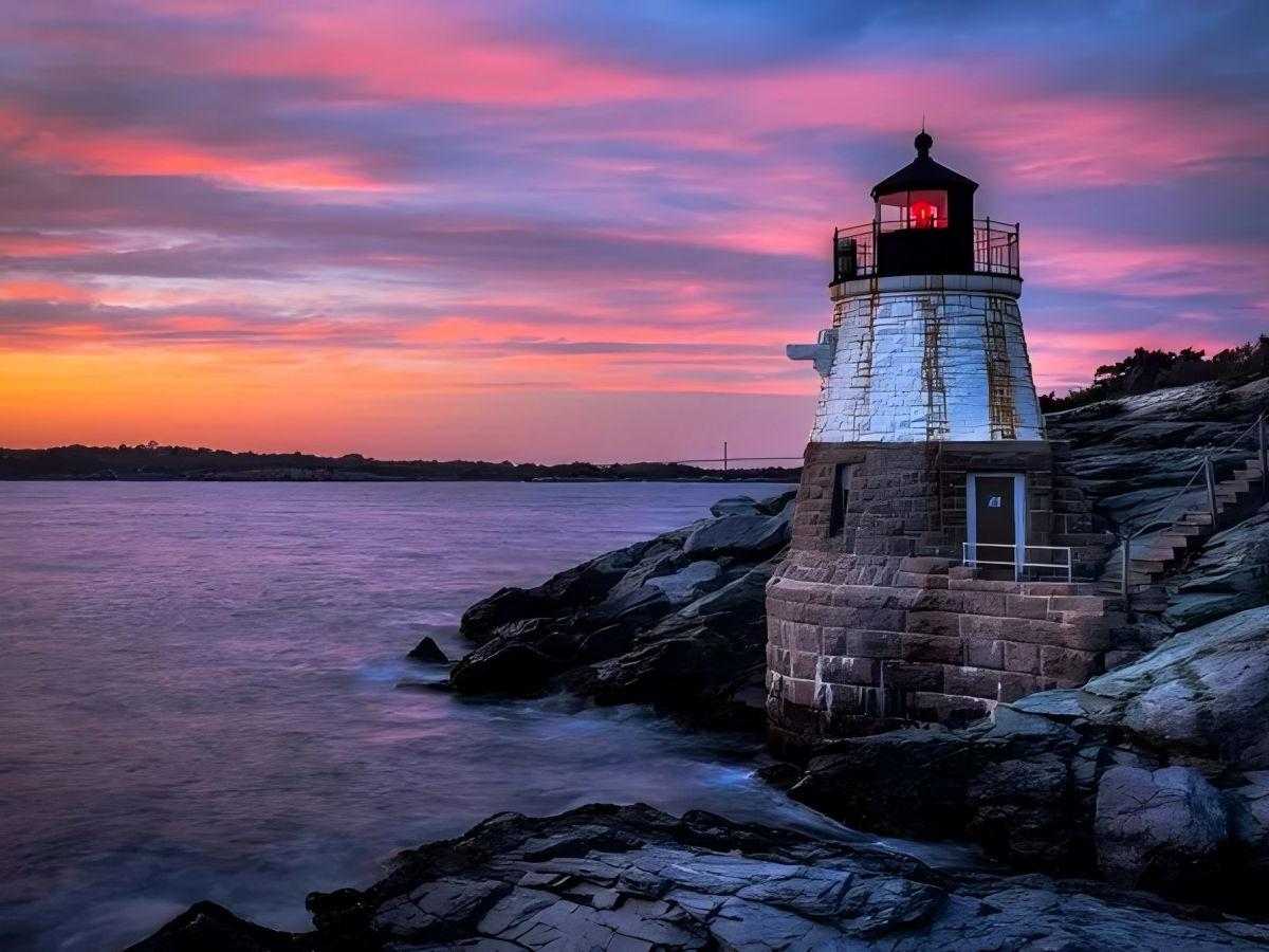Sunrise view: lighthouse and sea in the morning light