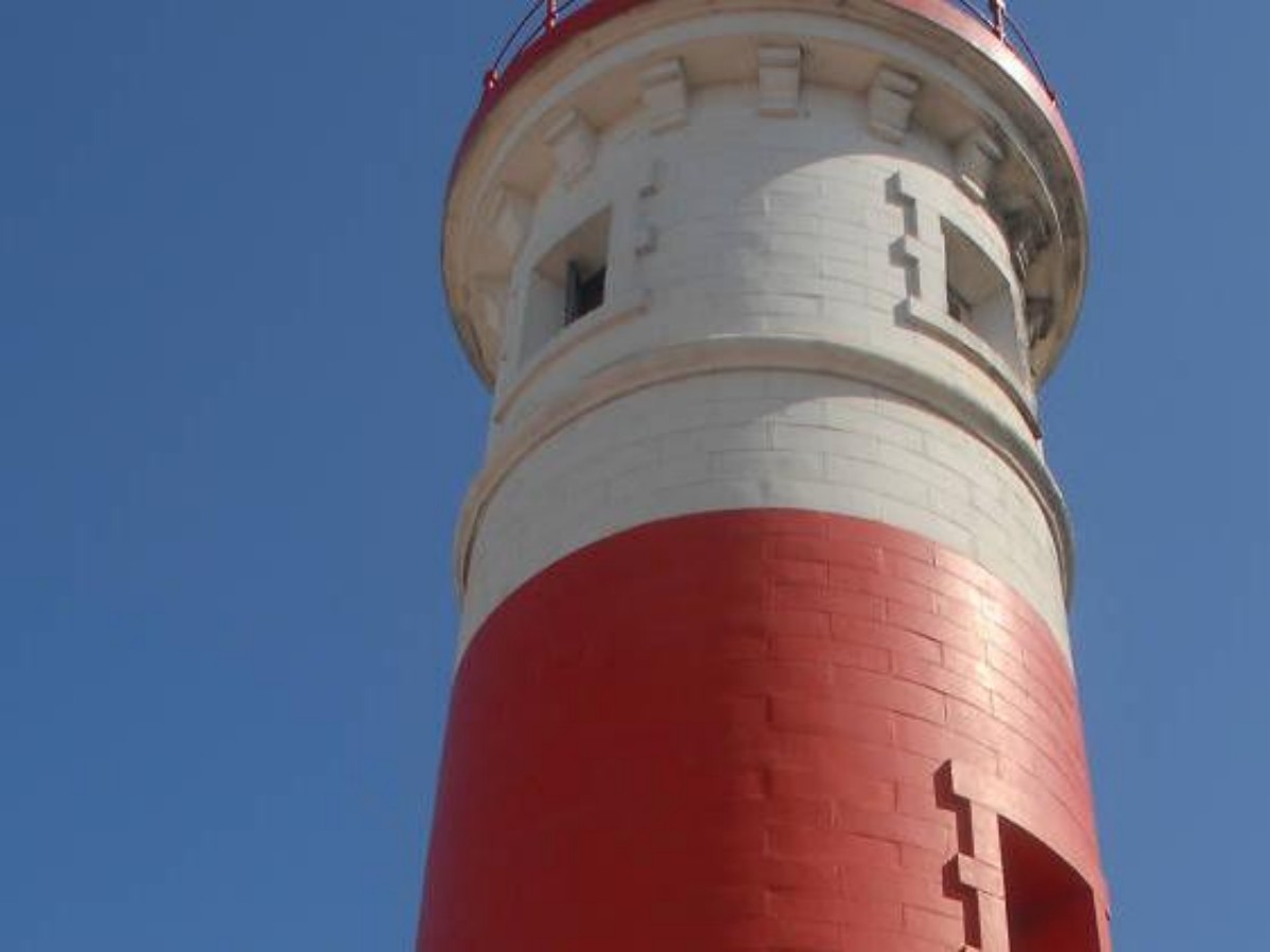 Climb to the top of the lighthouse and overlook the intersection of the city and the ocean